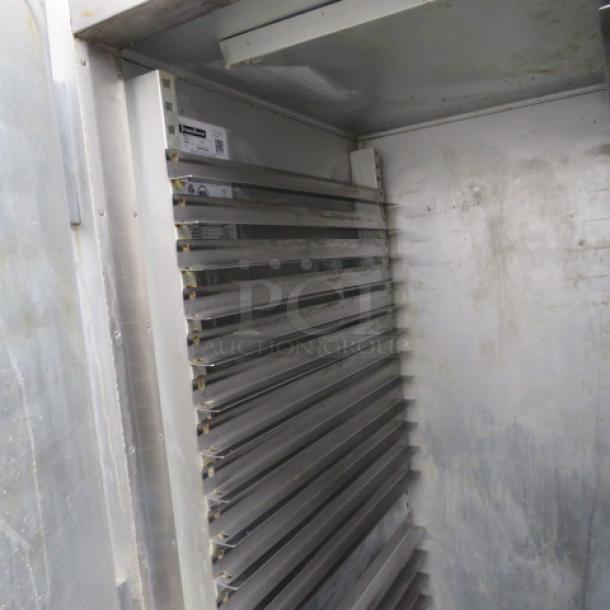 One Traulsen 2 Section  Dutch Door Refrigerator On Casters. Model# G20003. 115 Volt. 52X5X83.5. $6594.00 - Image 2 of 2