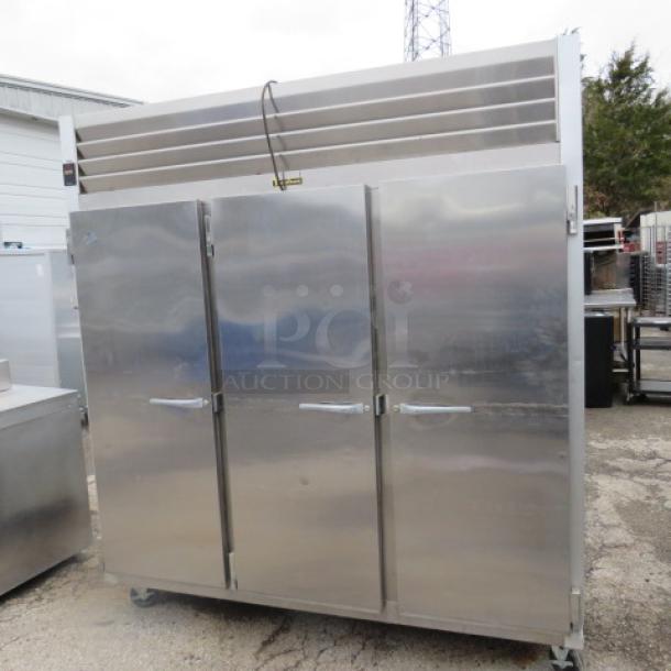 One WORKING Traulsen 3 Door Refrigerator With 9 Racks, On Casters. Model# G30011. 115 Volt. 76X32X84. $8510.36. - Image 2 of 4