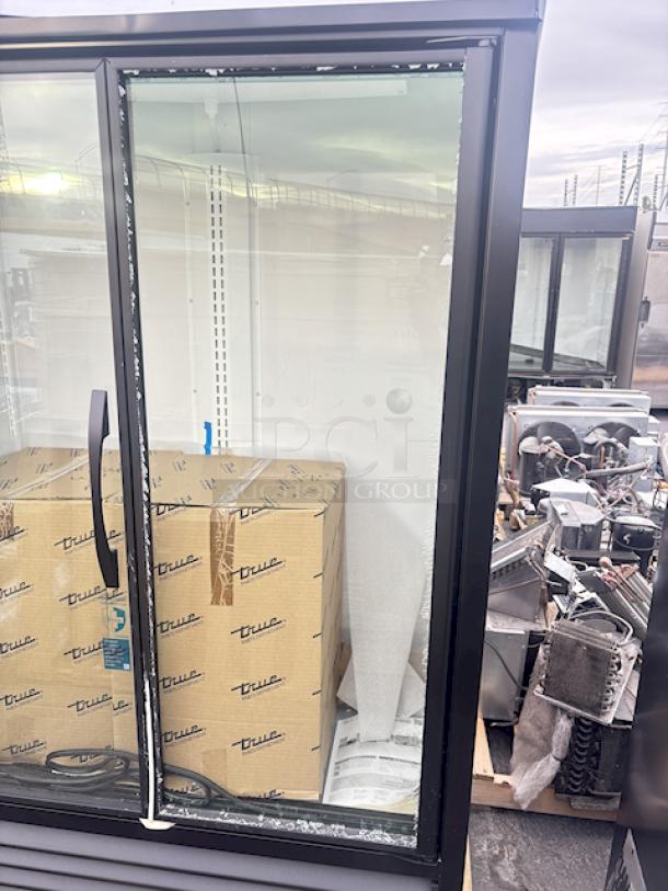 BRAND NEW SCRATCH & DENT! True TVM-48SL-HC~VM01 47 1/8" Black Narrow / Low Profile Refrigerated Glass Door Merchandiser with LED Lighting. 115v/60hz/1ph/4.2Amp.  S/N: 10951141 The top layer of glass on the right side door is shattered. the back side panel is dented. The top display is warped and dented. See photos. - Image 2 of 5