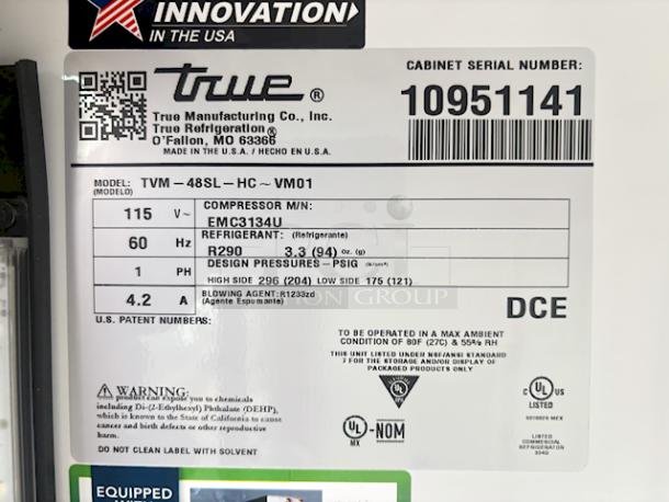 BRAND NEW SCRATCH & DENT! True TVM-48SL-HC~VM01 47 1/8" Black Narrow / Low Profile Refrigerated Glass Door Merchandiser with LED Lighting. 115v/60hz/1ph/4.2Amp.  S/N: 10951141 The top layer of glass on the right side door is shattered. the back side panel is dented. The top display is warped and dented. See photos. - Image 3 of 5