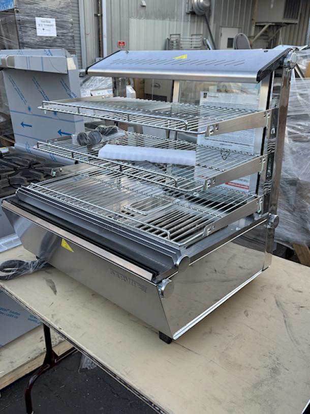 BRAND NEW SCRATCH & DENT! ServIt HDM-26 26" Self / Full Service 3 Shelf Countertop Heated Display Case with Sliding Doors - 120V, 1800W, 15 Amps	1 Phase	60 Hz	84 lb. S/N: 1556307300087. Glass is Broken On all sides. - Image 2 of 5