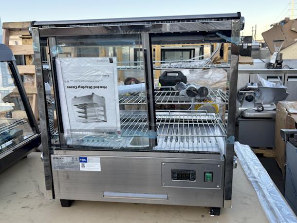 BRAND NEW SCRATCH & DENT! ServIt HDM-26 26" Self / Full Service 3 Shelf Countertop Heated Display Case with Sliding Doors - 120V, 1800W, 15 Amps	1 Phase	60 Hz	84 lb. S/N: 1556307300087. Glass is Broken On all sides. - Image 5 of 5