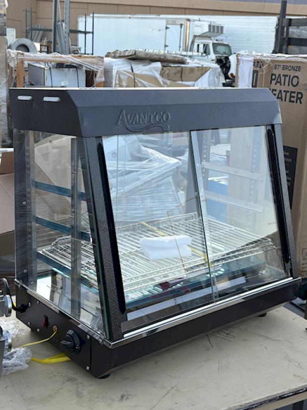 BRAND NEW SCRATCH & DENT! Avantco HDC-26 26" Self/Full Service 3 Shelf Countertop Heated Display Case with Sliding Doors - 120V, 1580W, S/N: CK-240270R- 256 N, 86Lb. Minor denting in upper corners. (see photos). - Image 3 of 9