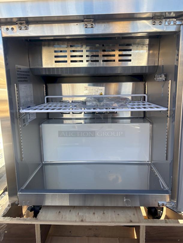BRAND NEW SCRATCH & DENT! Avantco APT-27-HC 27" 1 Door Refrigerated Sandwich Prep Table, 115 Volts	3.6 Amps	1 Phase	60 Hz	219 lb. S/N: 253717537. In Working Order. On Commercial Casters. Lid is dented and bent. - Image 5 of 7