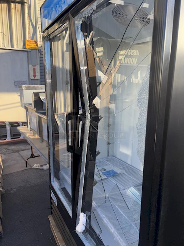 BRAND NEW SCRATCH & DENT! Avantco GDC-49-HC 53" Black Swing Glass Door Merchandiser Refrigerator with LED Lighting. Tested. In Working Order. 115 Volts/6 Amps/1 Phase/480 lb. S/N: 028081364. 53-1/8"x31-7/8"x83-7/8". Outer pane of glass is broken on the left side, both panes are broken on the right side,  doors and sides have dents. (see photos). - Image 4 of 10