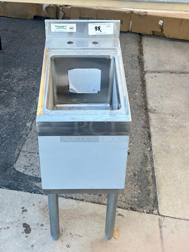 BRAND NEW OUT OF ORIGINAL PACKAGING! Regency 600UHS2112 1 Bowl Underbar Hand Sink - 21" x 12" x 33". 31.82 Lb. Includes drain and legs w/ adjustable bullet feet. Superficial denting, left back leg has a inward slight bend. (see photos). - Image 6 of 9