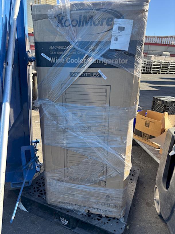 BRAND NEW SCRATCH & DENT! Koolmore KM-CW92DZ-SS 23 in. Dual Zone, Full Glass Door, Wine Cooler Refrigerator, Freestanding or Built-In Unit, 9.7 cu ft. Display up to 92-Bottle WineCollection 22.4" x 23.4" x 55" IN ORIGINAL PACKAGING!  TESTED! WORKS PERFECT! Dent on the bottom left. White stuff is styrofoam from the packaging. 
*This unit is located at our main warehouse approximately 10mins away. The address is 3290 S. Highland Dr. Las Vegas NV 89109.* - Image 2 of 13