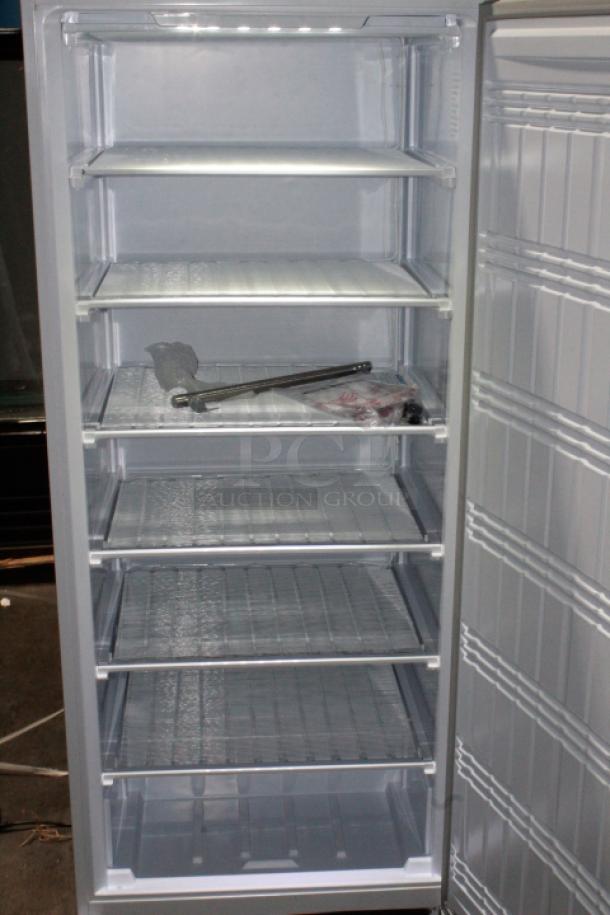 BRAND NEW SCRATCH & DENT! IN PERFECT WORKING ORDER!! Koolmore KM-FMD20WH 21 Cu. ft. Commercial Reach-in Freezer in White Manual Defrost, 115v. 27.4" x 30.1" x 74.4" 
Base and top of unit are dented. See Photos. TESTED! WORKS PERFECT!
*This unit is located at our main warehouse approximately 10mins away. The address is 3290 S. Highland Dr. Las Vegas NV 89109.* - Image 3 of 11