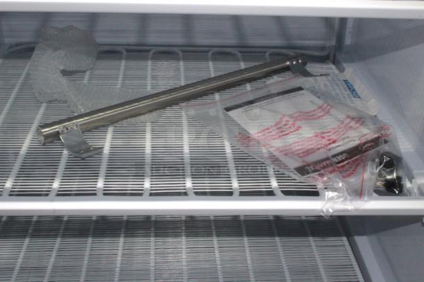 BRAND NEW SCRATCH & DENT! IN PERFECT WORKING ORDER!! Koolmore KM-FMD20WH 21 Cu. ft. Commercial Reach-in Freezer in White Manual Defrost, 115v. 27.4" x 30.1" x 74.4" 
Base and top of unit are dented. See Photos. TESTED! WORKS PERFECT!
*This unit is located at our main warehouse approximately 10mins away. The address is 3290 S. Highland Dr. Las Vegas NV 89109.* - Image 9 of 11