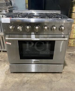 Thor Kitchen Commercial Stainless Steel Dual Fuel Powered 6 Burner Range! With Electric Powered Convectional Oven! With Brilliant Blue Porcelain Interior! With Luxglide Telescopic Racks! Model: HRD3606UV2 SN: HRD3606U2203839! 240V!
