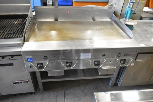 Garland Stainless Steel Commercial Gas Powered Flat Top Griddle w/ Under Shelf. - Image 1 of 7