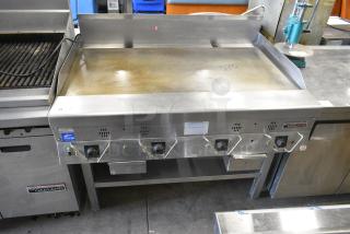Garland Stainless Steel Commercial Gas Powered Flat Top Griddle w/ Under Shelf.