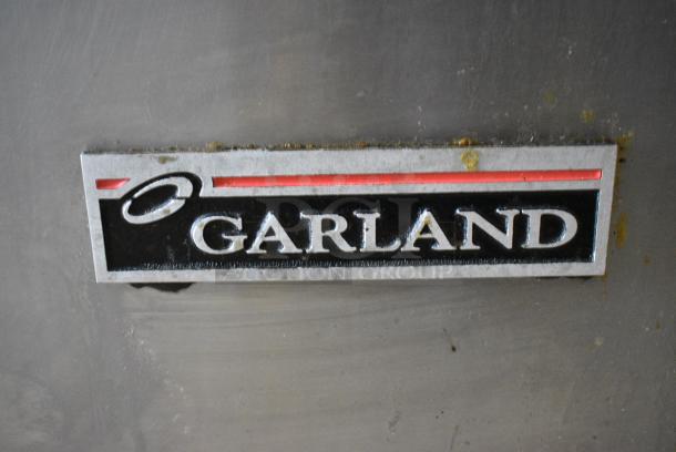 Garland M34B Stainless Steel Commercial  Natural Gas Powered Charbroiler Grill w/ Back Splash, 2 Doors and Under Shelf. - Image 2 of 8