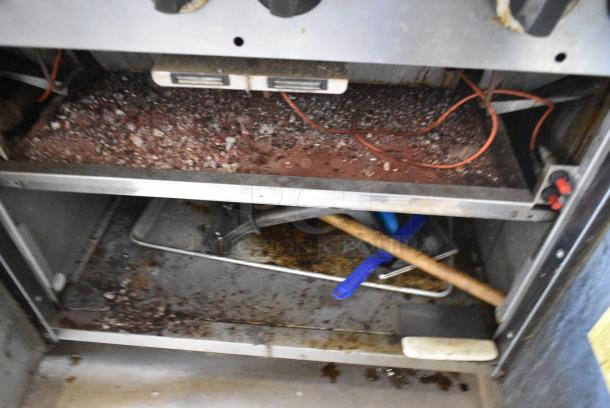 Garland M34B Stainless Steel Commercial  Natural Gas Powered Charbroiler Grill w/ Back Splash, 2 Doors and Under Shelf. - Image 7 of 8