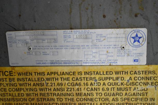 Garland M34B Stainless Steel Commercial  Natural Gas Powered Charbroiler Grill w/ Back Splash, 2 Doors and Under Shelf. - Image 8 of 8