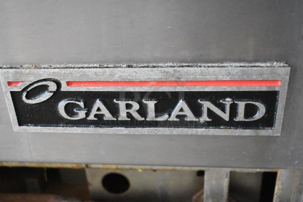 Garland M44R Stainless Steel Commercial Natural Gas Powered 4 Burner Range w/ Oven, Back Splash and Over Shelf. 40,000 BTU. - Image 2 of 6