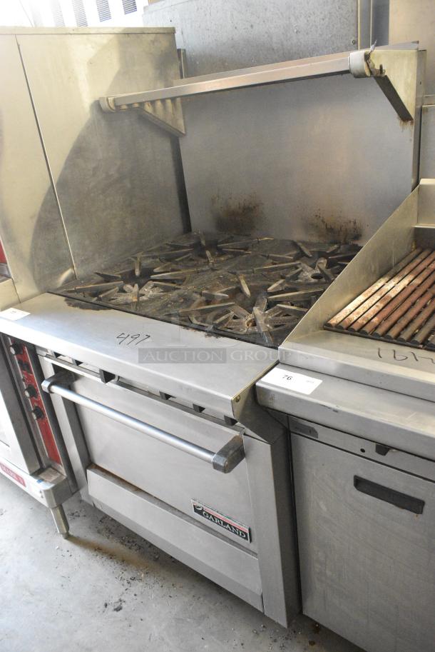 Garland M44R Stainless Steel Commercial Natural Gas Powered 4 Burner Range w/ Oven, Back Splash and Over Shelf. 40,000 BTU. - Image 4 of 6