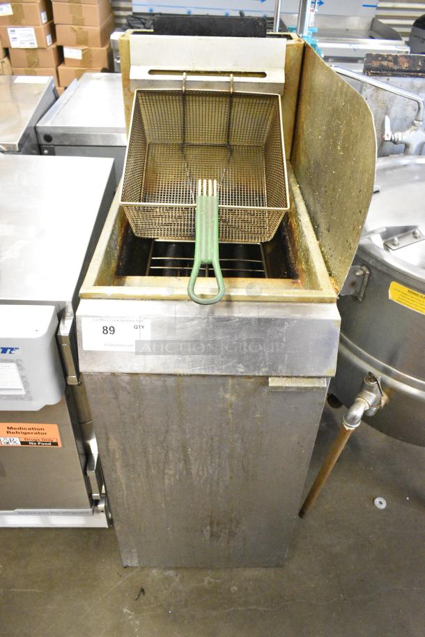 Stainless Steel Commercial Floor Style Natural Gas Powered Deep Fat Fryer w/ Metal Fry Basket and Side Splash Guard. - Image 1 of 5