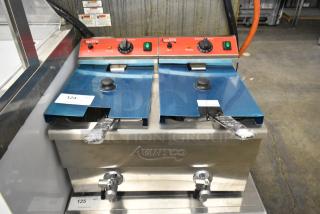 BRAND NEW SCRATCH AND DENT! 2023 Avantco 177F202 Stainless Steel Commercial Countertop Electric Powered 2 Bay Fryer w/ 2 Metal Fry Baskets and 2 Metal Lids. 208/240 Volts, 1 Phase.