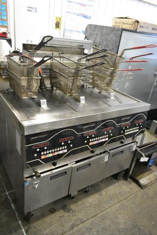 2016 Henny Penny EEE-143 FFFX ST Stainless Steel Commercial Floor Style Electric Powered 3 Bay Deep Fat Fryer w/ 6 Metal Fry Baskets on Commercial Casters. 208 Volts, 3 Phase.