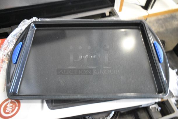 BRAND NEW SCRATCH AND DENT! Box of Nutrichef NCBK3S 3-Piece Nonstick Baking Pans Set - Premium Oven Bakeware with Silicone Handles, Non-Stick Heavy Duty Carbon Steel - Stackable & Easy to Clean, Ideal for Roasting & Baking - Blue - Image 1 of 6