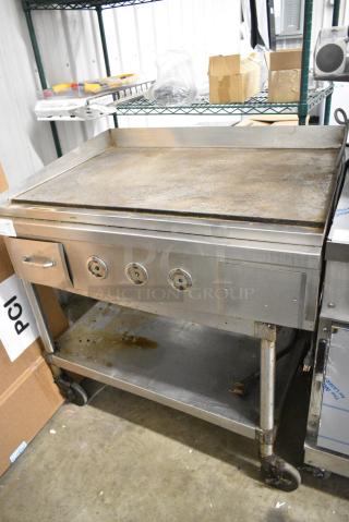 Stainless Steel Commercial Electric Powered Flat Top Griddle w/ Metal Under Shelf on Commercial Casters. 208/240 Volts, 3 Phase.