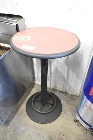 Round Bar Height Table on Black Metal Table Base.