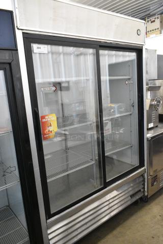 True TSD-47G Stainless Steel Commercial 2 Door Reach In Cooler Merchandiser on Commercial Casters. 115 Volts, 1 Phase. Tested and Working!