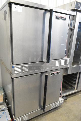 2 Garland Master 200 Stainless Steel Commercial  Electric Powered Full Size Convection Oven w/ Solid Doors, Metal Oven Racks and Thermostatic Controls on Commercial Casters. 240/480 Volts, 3 Phase.  2 Times Your Bid!