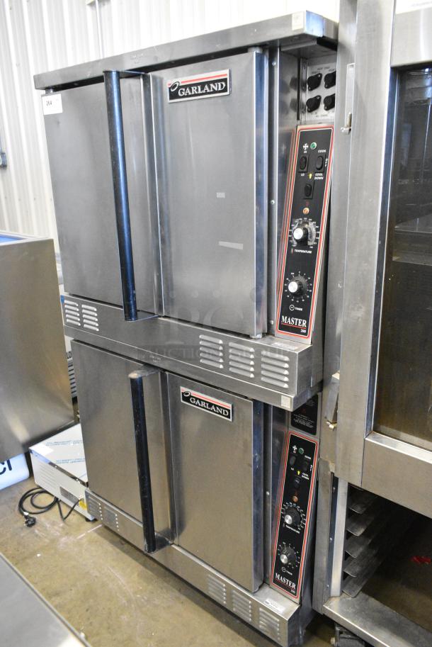 2 Garland Master 200 Stainless Steel Commercial  Electric Powered Full Size Convection Oven w/ Solid Doors, Metal Oven Racks and Thermostatic Controls on Commercial Casters. 240/480 Volts, 3 Phase.  2 Times Your Bid! - Image 2 of 7