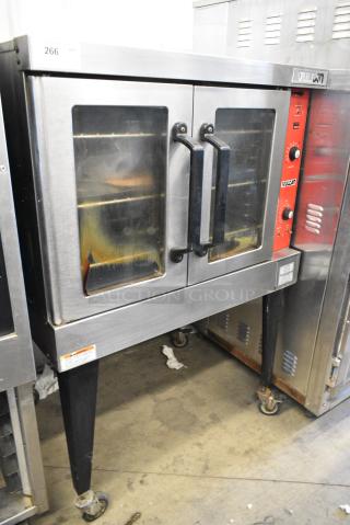 Vulcan VC4ED Stainless Steel Commercial Full Size Convection Oven w/ View Through Doors, Metal Oven Racks, Thermostatic Controls and Metal Legs on Commercial Casters. 240 Volts, 3/1 Phase.