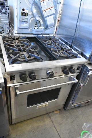 Wolf Stainless Steel Commercial Natural Gas Powered 4 Burner Range w/ Convection Oven.