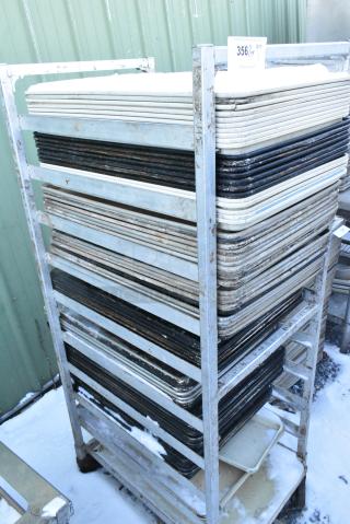 Metal Commercial Pan Transport Rack on Commercial Casters w/ Approximately 15 Pans and 40 Metal Baking Pans.