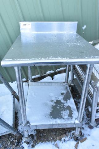 Stainless Steel Table w/ Back Splash and Under Shelf on Commercial Casters.