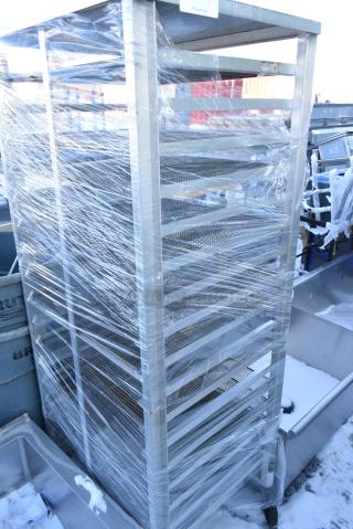 Metal Commercial Pan Transport Rack w/ Donut Frying Screens on Commercial Casters.