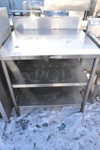 Stainless Steel Table w/ Back Splash and 2 Under Shelves.