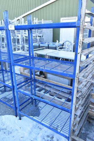 Blue 4 Tier Wire Shelving Unit. BUYER MUST DISMANTLE. PCI CANNOT DISMANTLE FOR SHIPPING. PLEASE CONSIDER FREIGHT CHARGES.