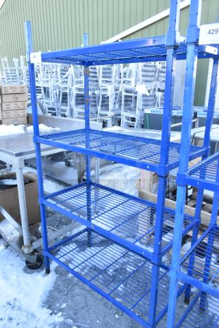 Blue 4 Tier Wire Shelving Unit. BUYER MUST DISMANTLE. PCI CANNOT DISMANTLE FOR SHIPPING. PLEASE CONSIDER FREIGHT CHARGES.