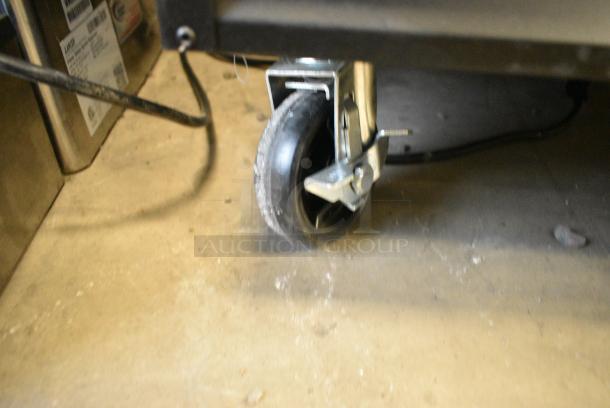 BRAND NEW SCRATCH AND DENT! 2023 Avantco 178GDC23HCB 28 3/8" Black Customizable Swing Glass Door Merchandiser Refrigerator with LED Lighting and Poly Coated Racks on Commercial Casters. 115 Volts, 1 Phase. Tested and Working! - Image 8 of 10