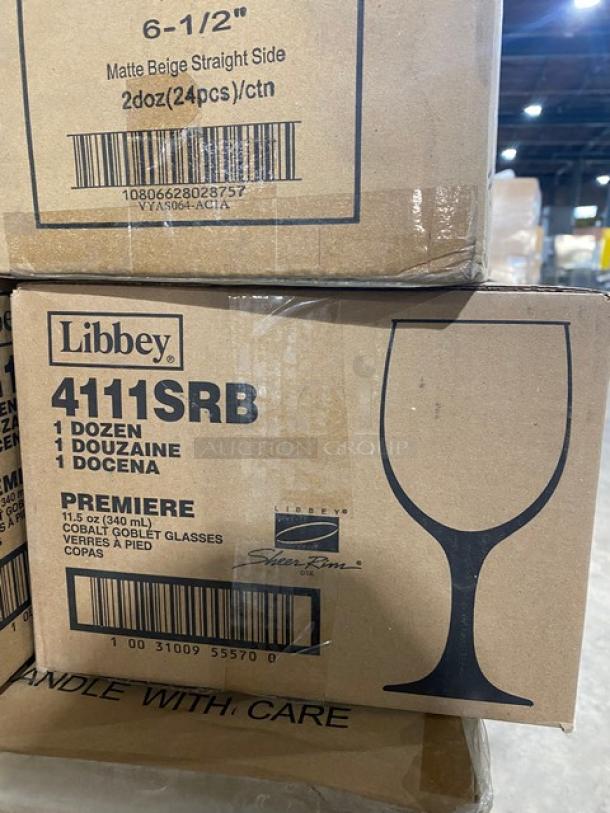 NEW! MIXED PALLET! Tuxton Naples 45 Ristorante Series Commercial Eggshell White Porcelain High Quality 15 Oz. Pasta Bowls! Model: PIDA112! With Libbey Commercial Cobalt Blue 11.75 Oz, Premiere Goblet Glasses! Model: 4111SRB! With TableCraft Commercial Black Melamine 5 Qt. 20"x6"x3" Straight Sided Bowls! Model: M4017BK! With Tablecraft Commercial Black Oval Woven Style Bread/Serving Baskets! Model: 2471! With Commercial Happy New Years Style Placemats & Napkins Combo Pack! With Tuxton TuxTrendz Series Commercial Zion Matte Beige 6 1/2" Straight-Sided China Plates! Model: VYAS064! With Figgjo Norway Commercial Aura Plates! Model: 9004HH! With Tablecraft Pulito Commercial White Melamine 5 Oz. Creamers! Model: 10414! & More! ALL NEW IN THE BOX! 79X Your Bid! - Image 6 of 10