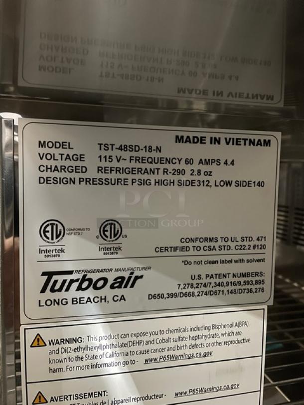 BRAND NEW! IN THE BOX! Turbo Air Super Deluxe Series Commercial Stainless Steel 2 Door Refrigerated Bain Marie Style Mega Top Sald/Sandwich Prep Table! With Chrome Plated Wire Racks! With Full Length Removable Cutting Board! With Clear Polycarbonate Food Pans! Model: TST-48SD-18-N SN: H2VTM4RI9002! 115V 1 Phase! With Casters! - Image 12 of 15