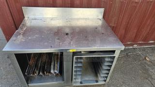 Stainless Steel Work Table. Contents inside rack are not included.