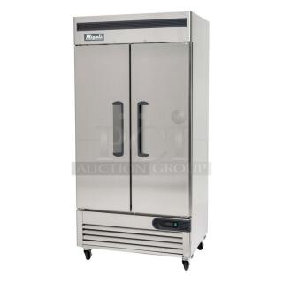BRAND NEW SCRATCH AND DENT! 2024 Migali C-2FB-HC Stainless Steel Commercial 2 Door Reach In Freezer w/ Poly Coated Racks on Commercial Casters. 115 Volts, 1 Phase. Serial C-2FB-HC240530C007. Tested and Working!