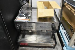BRAND NEW SCRATCH AND DENT! Estella 236ECEM2C Stainless Steel Commercial Countertop 2 Group Espresso Machine w/ 2 Portafilters and Steam Wand. 110 Volts, 1 Phase.