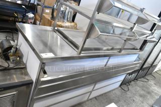 BRAND NEW SCRATCH AND DENT! Atlas DDC-4 Stainless Steel Commercial Buffet Station w/ Tray Slide, 2 Shelves and Sneeze Guard. 115 Volts, 1 Phase. Tested and Working!