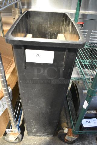Black Poly Slim Jim Trash Can w/ Contents Including Brocks for Pizza Oven.