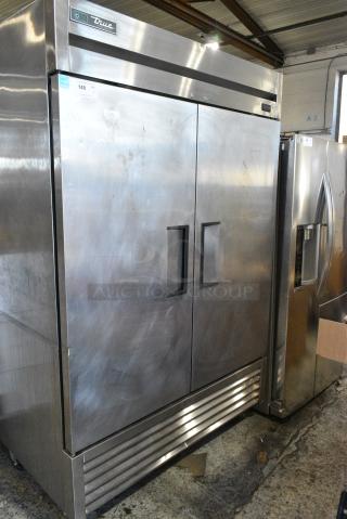 2019 True TS-49-HC Stainless Steel Commercial 2 Door Reach In Cooler w/ Poly Coated Racks on Commercial Casters. 115 Volts, 1 Phase. Tested and Powers On But Does Not Get Cold