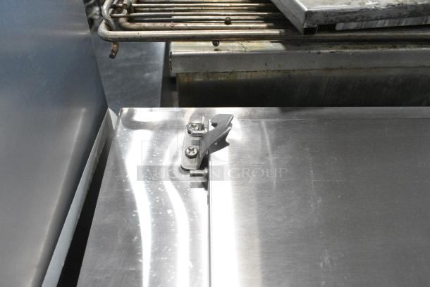 BRAND NEW SCRATCH AND DENT! 2024 Avantco 178APPT91HC Stainless Steel Commercial 92" 3 Door Refrigerated Pizza Prep Table on Commercial Casters. 115 Volts, 1 Phase. Tested and Working! - Image 4 of 12