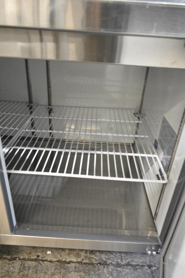 BRAND NEW SCRATCH AND DENT! 2024 Avantco 178APPT91HC Stainless Steel Commercial 92" 3 Door Refrigerated Pizza Prep Table on Commercial Casters. 115 Volts, 1 Phase. Tested and Working! - Image 9 of 12