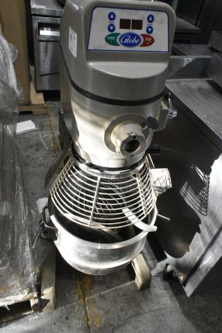 Globe SP30 Metal Commercial Floor Style 30 Quart Planetary Dough Mixer w/ Stainless Steel Mixing Bowl, Bowl Guard, Dough Hook, Paddle and Whisk Attachments. 115 Volts, 1 Phase. Tested and Powers On But Parts Do Not Move